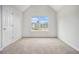 Bedroom with large window, neutral carpet, and a closet at 1024 Odelle Cir, Mcdonough, GA 30253