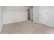 Neutral bedroom featuring a door to a closet, and neutral colored carpet at 1024 Odelle Cir, Mcdonough, GA 30253