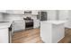 Modern kitchen featuring stainless steel appliances, white cabinets, and an island at 1024 Odelle Cir, Mcdonough, GA 30253