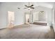 Spacious living room with high vaulted ceiling, plush carpet and steps to another level at 1024 Odelle Cir, Mcdonough, GA 30253