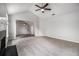 Open-concept living room with vaulted ceiling, a fireplace, and a ceiling fan at 1024 Odelle Cir, Mcdonough, GA 30253