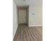 Neutral hallway with a front door and hardwood floors at 105 Lena Cir, Stockbridge, GA 30281