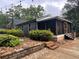 Cozy home with a screened in porch and manicured landscaping at 284 Harris Loop, Dallas, GA 30157