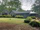 Expansive backyard featuring manicured landscaping and a detached garage at 284 Harris Loop, Dallas, GA 30157