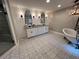 Bathroom with decorative tile flooring, double vanity and free standing tub at 284 Harris Loop, Dallas, GA 30157