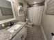 Bathroom featuring granite countertop, white vanity and hexagon tile flooring at 284 Harris Loop, Dallas, GA 30157