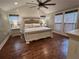 Main bedroom with hardwood floors, recessed lights, and decorative bedside lamps at 284 Harris Loop, Dallas, GA 30157