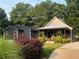 Charming home featuring a covered porch, manicured landscaping, and inviting curb appeal at 284 Harris Loop, Dallas, GA 30157