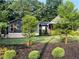 Beautifully landscaped front yard showcasing a well-maintained lawn and attractive plantings at 284 Harris Loop, Dallas, GA 30157