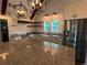 Bright kitchen with granite counters, stainless steel appliances, and farmhouse sink at 284 Harris Loop, Dallas, GA 30157