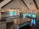 Bright kitchen with granite countertops, a center island, and stainless steel appliances at 284 Harris Loop, Dallas, GA 30157