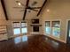 Cozy living room featuring hardwood floors, large windows, and a brick fireplace at 284 Harris Loop, Dallas, GA 30157