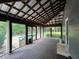 Screened-in porch overlooks the pool, perfect for outdoor living and entertaining at 284 Harris Loop, Dallas, GA 30157