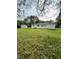 Expansive backyard view, showcasing the house and the surrounding landscape at 66 Lakeshore Dr, Bowdon, GA 30108