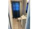Clean bathroom featuring a tiled floor, sink, mirror, and toilet at 66 Lakeshore Dr, Bowdon, GA 30108
