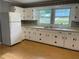 Spacious kitchen featuring ample cabinet space, neutral countertops, and a functional layout at 66 Lakeshore Dr, Bowdon, GA 30108
