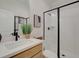 Modern bathroom featuring a glass-enclosed shower, a vanity, and a framed mirror at 133 Prescott Manor Dr, Canton, GA 30115