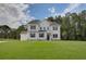 Beautiful two-story white home with black shutters, set on a large manicured lawn at 133 Prescott Manor Dr, Canton, GA 30115