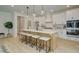 Bright kitchen with white cabinets, an island with seating, and stainless steel appliances at 133 Prescott Manor Dr, Canton, GA 30115