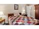 Bedroom with wood furniture, neutral walls, and a framed painting above the bed at 2365 Fontaine Cir, Decatur, GA 30032