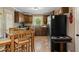 Cozy kitchen with tile flooring, dark cabinets, and bright natural lighting at 2365 Fontaine Cir, Decatur, GA 30032