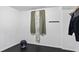 Room with black floors, white walls, and a small window with light-colored curtains at 2365 Fontaine Cir, Decatur, GA 30032