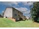 Expansive backyard featuring a well-maintained lawn and a spacious deck at 2405 Brisbane Dr, Conyers, GA 30013