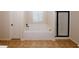 Bathroom featuring a soaking tub, tile flooring, and walk in shower at 2405 Brisbane Dr, Conyers, GA 30013