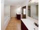 Bathroom featuring double vanity sinks and a soaking tub at 2405 Brisbane Dr, Conyers, GA 30013