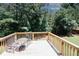 Inviting outdoor deck with seating, perfect for relaxing and enjoying the serene backyard view at 2405 Brisbane Dr, Conyers, GA 30013