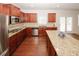 Well-appointed kitchen with granite countertops, stainless steel appliances, and a center island at 2405 Brisbane Dr, Conyers, GA 30013