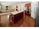 Open-concept kitchen with a center island, modern appliances, and seamless flow to the living area at 2405 Brisbane Dr, Conyers, GA 30013