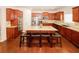 Spacious kitchen featuring cherry wood cabinets, stainless steel appliances, and an island with seating at 2405 Brisbane Dr, Conyers, GA 30013