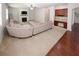 Cozy living room with a fireplace, neutral carpet, and a comfortable seating area at 2405 Brisbane Dr, Conyers, GA 30013