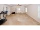 Spacious main bedroom with plush carpeting, neutral tones, and ceiling fan at 2405 Brisbane Dr, Conyers, GA 30013