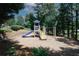 Community playground with slide, climbing structure, and swings for outdoor fun at 2405 Brisbane Dr, Conyers, GA 30013