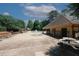 Community pool area with fountain, surrounded by lounge chairs and shaded seating, perfect for relaxation at 2405 Brisbane Dr, Conyers, GA 30013