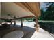 Covered community pool area featuring picnic tables and a glimpse of the sparkling swimming pool at 2405 Brisbane Dr, Conyers, GA 30013