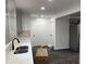 Bright kitchen featuring light gray cabinets, white countertops, and stainless steel sink at 388 Sargent Se Dr, Atlanta, GA 30315