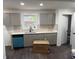Bright kitchen features gray cabinets, white countertops, and a modern backsplash at 388 Sargent Se Dr, Atlanta, GA 30315