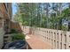 Backyard with a patio, wooden privacy fence and an air conditioning unit at 441 Mountain View Ln, Woodstock, GA 30188