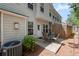 Backyard patio with outdoor seating arrangement and an air conditioning unit at 441 Mountain View Ln, Woodstock, GA 30188