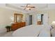 Comfortable primary bedroom with tray ceiling, carpet floor and ensuite bath at 441 Mountain View Ln, Woodstock, GA 30188