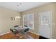Small dining area featuring a glass table, hardwood flooring, and a back door at 441 Mountain View Ln, Woodstock, GA 30188