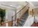 Inviting entryway with hardwood floors, staircase with detailed spindles, and ample natural light at 441 Mountain View Ln, Woodstock, GA 30188