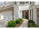 Inviting townhome entrance with brick accents and manicured landscaping at 441 Mountain View Ln, Woodstock, GA 30188