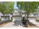 Charming townhome with a well-manicured front yard and attached two-car garage at 441 Mountain View Ln, Woodstock, GA 30188