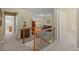 Hallway with carpet, view to a sitting area and a bedroom with natural light at 441 Mountain View Ln, Woodstock, GA 30188