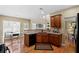 Cozy kitchen features granite counters, a dishwasher, and hardwood flooring at 441 Mountain View Ln, Woodstock, GA 30188