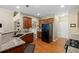 Modern kitchen with granite counters, stainless steel appliances, and hardwood flooring at 441 Mountain View Ln, Woodstock, GA 30188